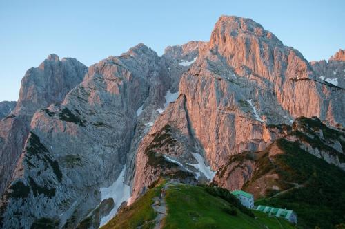 a mountain with a train in the middle of it at Gästehaus-Pension Bendler in Kirchdorf in Tirol