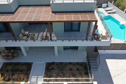 an aerial view of a building with a swimming pool at Manuel's Dream in Ádhele