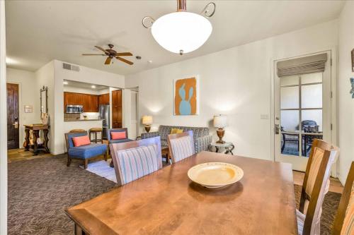 a dining room and living room with a table and chairs at Ground Floor 1BR Legacy Villa #A in La Quinta