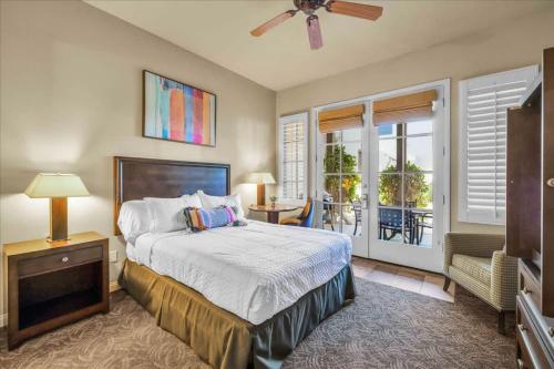 a bedroom with a bed and a balcony at Ground Floor 1BR Legacy Villa #A in La Quinta