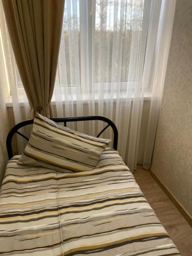 Postel nebo postele na pokoji v ubytování Mini Hotel Leon