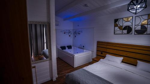Postel nebo postele na pokoji v ubytování Mano Village