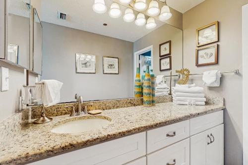 a bathroom with a sink and a mirror at Phoenix East in Orange Beach