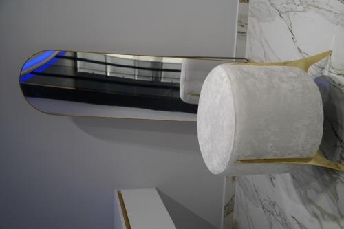 a roll of toilet paper on a holder in a bathroom at Luxury holidays shengjin in Shëngjin