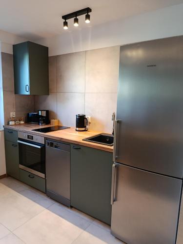 Kuchyň nebo kuchyňský kout v ubytování Apartament Dworska
