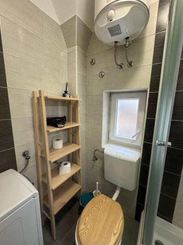 a small bathroom with a toilet and a window at Julija Palace in Split