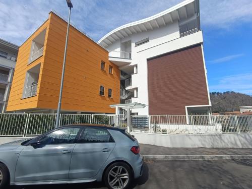 a small car parked in front of a building at Como N 5 - Luxury apartment in Como