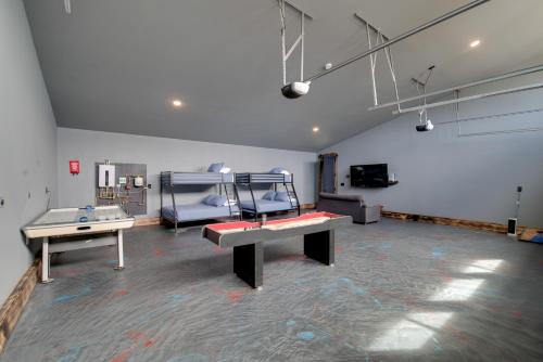 a room with two ping pong tables in it at Steps to Shore Family Beach Getaway in Westport in Westport