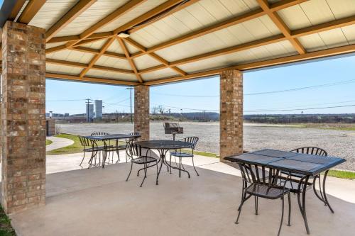 a group of tables and chairs on a patio at Best Western Club House Inn & Suites in Mineral Wells