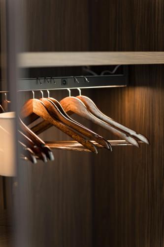 a bunch of wooden utensils in an oven at Valesium Suite in Lecce