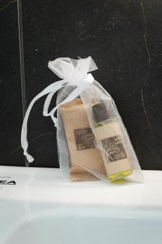 a bag with a book in it on a table at Valesium Suite in Lecce