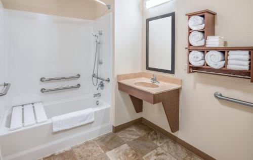 a bathroom with a sink and a shower at My Place Hotel-South Omaha/La Vista, NE in La Vista