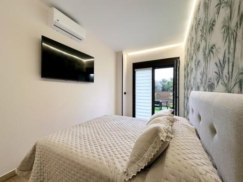 Postel nebo postele na pokoji v ubytování Flower Deluxe Bajo 2 Dormitorios 6085