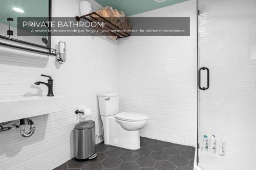 a bathroom with a toilet and a sink and a shower at Lake House in Orlando