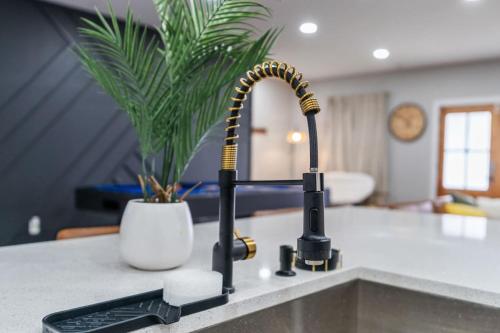 a kitchen sink with a faucet on a counter at Comfy Rm, 1 Bed Near Downtwn Indy in Indianapolis