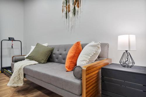 a couch with pillows on it in a living room at Comfy Rm, 1 Bed Near Downtwn Indy in Indianapolis