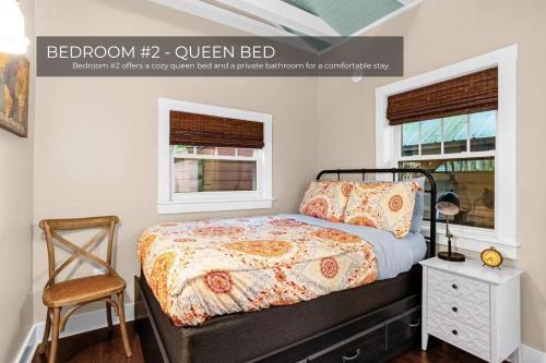 a bedroom with a bed and a chair and windows at Lake House in Orlando