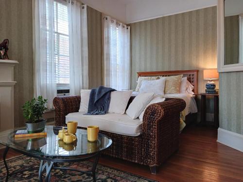 a living room with a couch and a table at Rosemont B&B Cottages in Little Rock