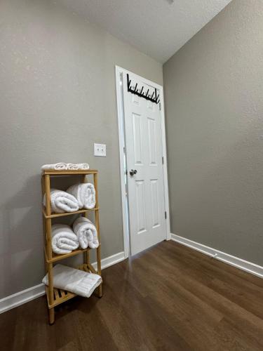 a room with a room with a door with towels at Newly built 3 level home 2 minute drive to UCM in Warrensburg