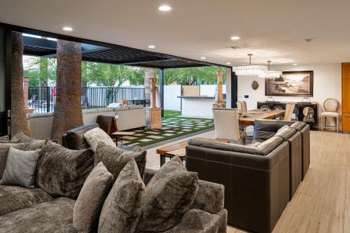 a living room with couches and a dining room at Arcadia Beach Club - 4-Villa Luxe Retreat with Pool in Phoenix