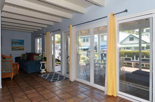 a living room with sliding glass doors leading to a patio at 211CL 211 Claressa in Avalon