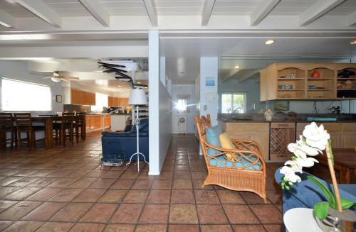 a kitchen and living room with a table and chairs at 211CL 211 Claressa in Avalon