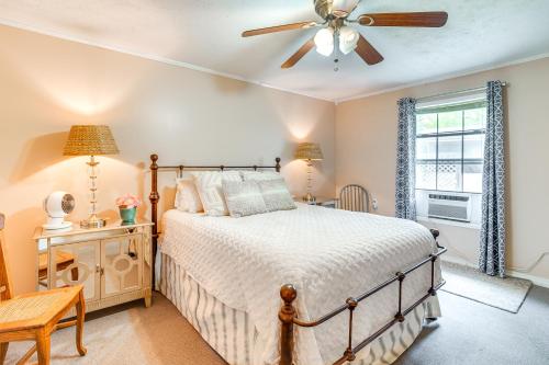 a bedroom with a bed and a ceiling fan at Waterfront House on Toledo Bend with Private Dock! in Alliance