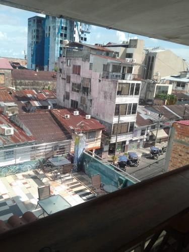 a view from a window of a city with buildings at Casa Nativa Iquitos in Iquitos