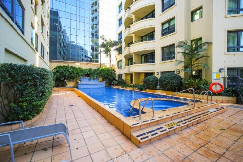 a swimming pool in the middle of a building at 1 Valentine Ave in Sydney