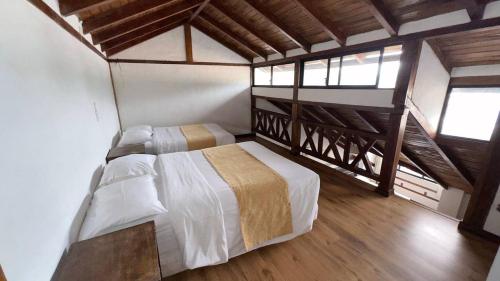 Ένα ή περισσότερα κρεβάτια σε δωμάτιο στο Hotel Noris Alausí
