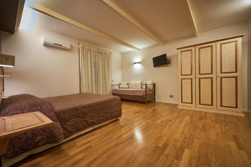a hotel room with a bed and a sliding door at B&B Le Stanze del Duomo in Florence