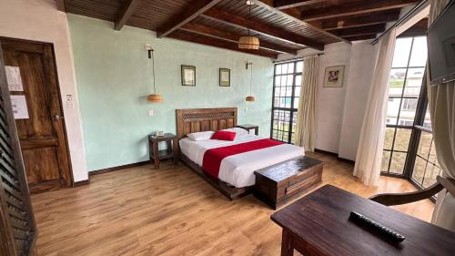 Ένα ή περισσότερα κρεβάτια σε δωμάτιο στο Hotel Noris Alausí