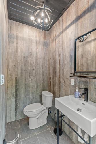 a bathroom with a toilet and a sink at WiFi & Adventure - The Overlook Luxury in Rogers