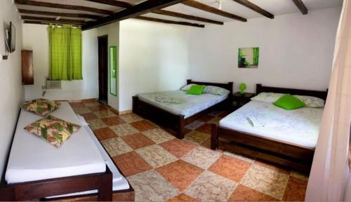 Ein Bett oder Betten in einem Zimmer der Unterkunft Hotel Palma Real