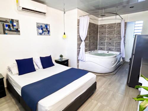 Ένα ή περισσότερα κρεβάτια σε δωμάτιο στο BlueApartaHotel
