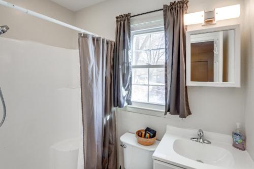 a bathroom with a toilet and a sink and a window at Dtwn Boone Home Walk to Appalachian State Campus! in Boone