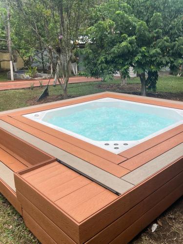 a large swimming pool with a wooden deck at Villa El Rio in Cali