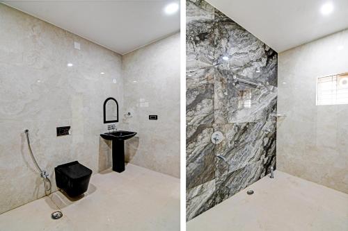 a bathroom with a stone shower and a sink at Hotel O SRI SAI PALACE in Bārang