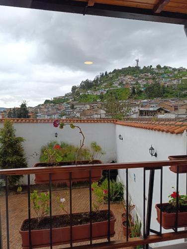 a balcony with a view of a city at Casona Tobar Hotel in Quito