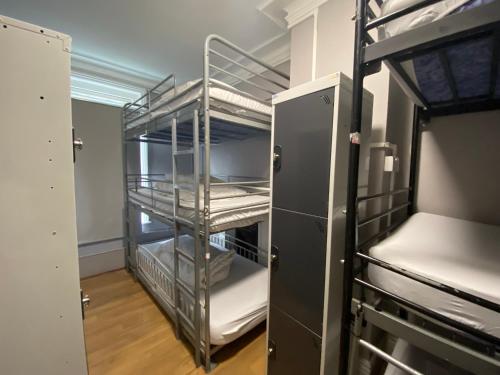 a room with an empty room with a refrigerator at Queen Elizabeth Hostel in London