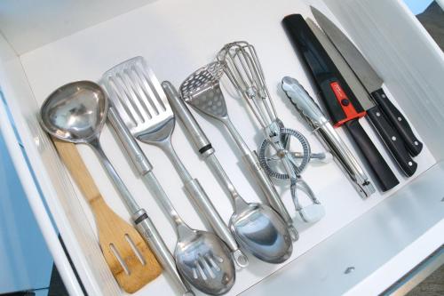 a drawer filled with utensils on a table at Park Avenue - IKON Glen Waverley in Glen Waverley