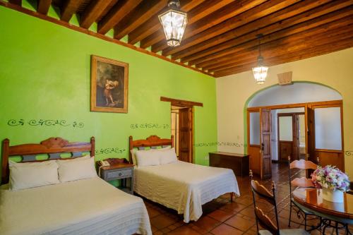 Postel nebo postele na pokoji v ubytování Hotel Casa del Refugio