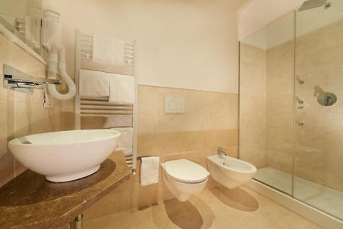 a bathroom with a sink and a toilet and a shower at B&B Le Stanze del Duomo in Florence