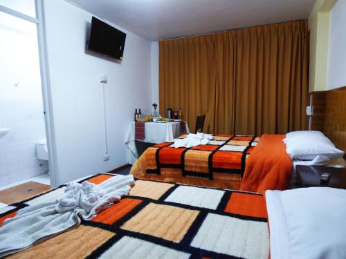Postel nebo postele na pokoji v ubytování Nak Hoteles Plaza