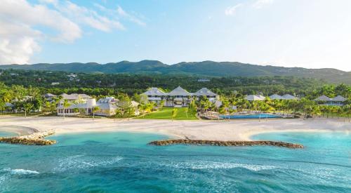 an aerial view of a beach with houses and the ocean at Half Moon in Montego Bay