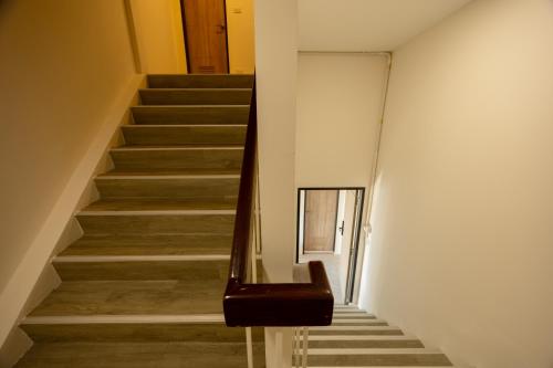 a staircase in a building with a stair case at Diff Apartel Banglamphu in Bangkok
