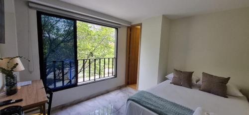 Ein Bett oder Betten in einem Zimmer der Unterkunft Hotel RUTA365