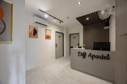 an office with a reception desk in a room at Diff Apartel Banglamphu in Bangkok
