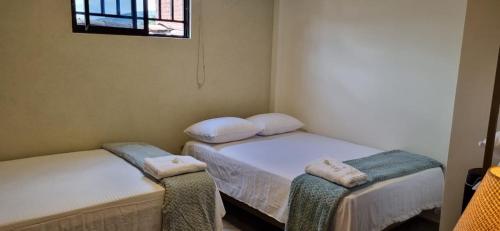 Ein Bett oder Betten in einem Zimmer der Unterkunft Hotel RUTA365