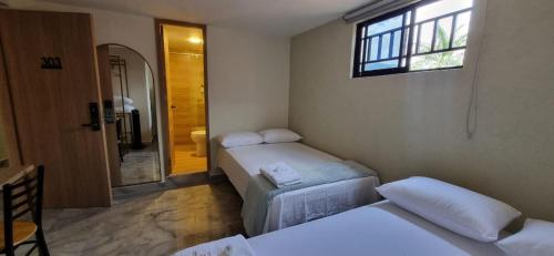 Ein Bett oder Betten in einem Zimmer der Unterkunft Hotel RUTA365